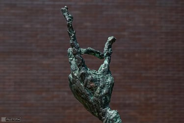 Close‑up of the master’s hand, index finger raised mid‑argument.