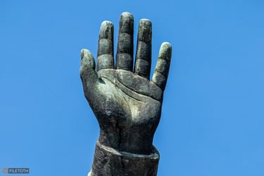 Captain Steinmetz’s raised left hand, open in a gesture of truce.
