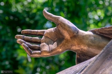 Saint Barbara’s protective hand, fingers gently curved in a guarding gesture.