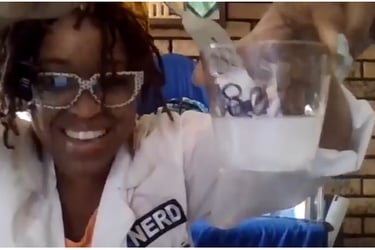 Shenell is pictured during a science experiment demo for a classroom via zoom