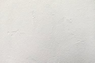 ¨Plâtre - Minimalist white plaster wall texture with subtle concrete surface imperfections.