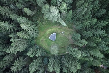 droneshot hubertuskapelle from above in the woods