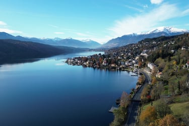 droneshot village with lake millstatt