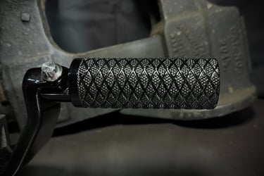 Knurled black motorcycle foot peg