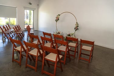 a room with chairs and chairs and a table