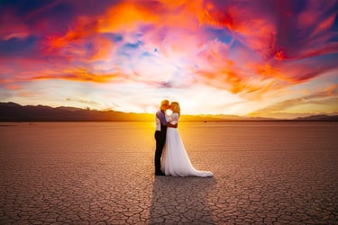a bride and groom standing in the desert