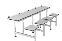 Modern industrial lunchroom table with attached swivel seats and a durable metal frame.