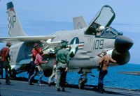 A F8 fighter jet on the deck of the USS Hancock. VF 211