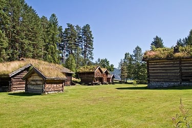 grass roofed wooden buildings in a valley-Kviteseid Bygdemuseum-cite