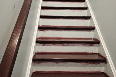 a staircase case with new wood stain