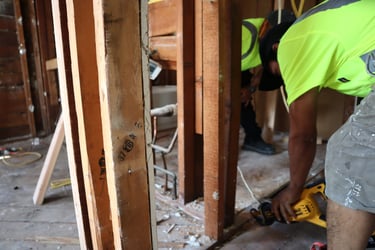 Renjay Remodeling team member performing structural demolition work in Connecticut
