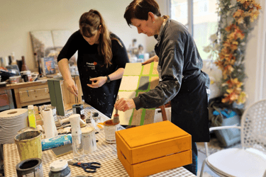 Image of 2 ladies participating in a Beginner's furniture painting workshop with Absolutely Mintage