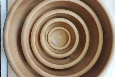 a set of hand turned nesting wood bowls