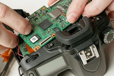 Dismantled camera being repaired