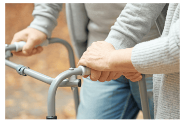 a woman holding a walker frame in her hands