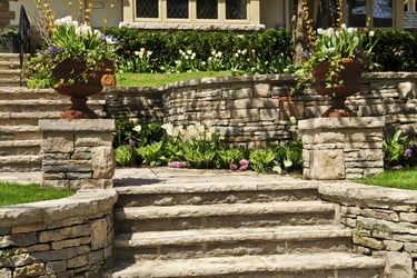 Beautiful stone retaining wall installation by West Linn Concrete, improving landscape design and functionality.