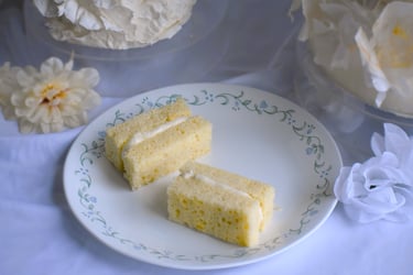 Two slices of moist layer cake on a vintage floral plate wedding cake serving size Chicago