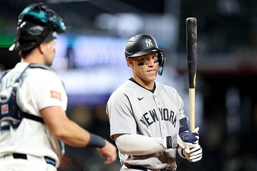 - APRIL 01: Aaron Judge #99 of the New York Yankees looks at Cal Raleigh #29 of the Seattle Mariners in Seattle, Washington