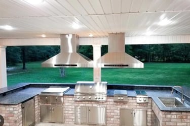 a kitchen with a grill and a grill