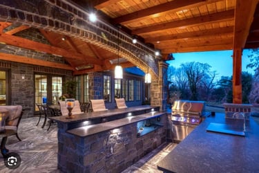 a kitchen with a bar stool and a bar stool