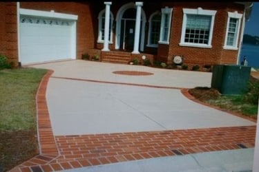 a brick house with a driveway with a driveway with brickwork