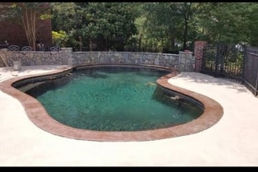 a man cleaning a pool with a mop