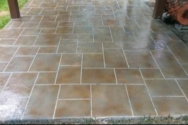 a patio with a brick patio with a brick patio