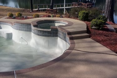 a pool with a large pool and a dock