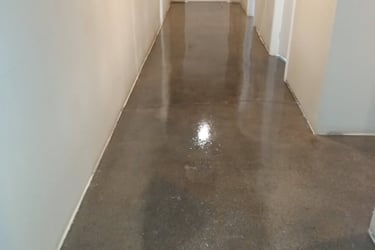 a hallway with a door leading to a hallway