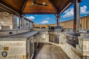 a kitchen with a ceiling fan and a ceiling fan