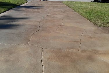 a skateboarder is riding his skateboard down a sidewalk