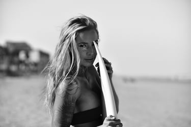 A portrait of a blonde surfer girl