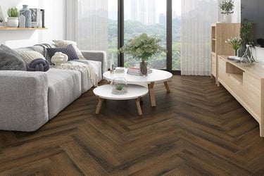 Modern living room featuring dark oak herringbone pattern laminate flooring