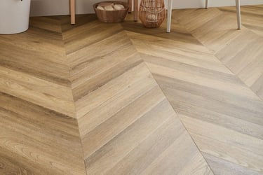 Modern bathroom featuring light oak chevron patterned luxury vinyl 