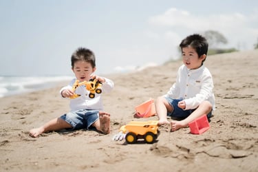 Children playing in the sand during a relaxed family photography session in Seminyak Bali