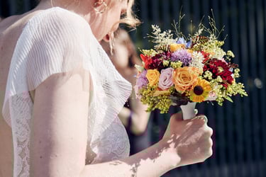 Bride holding a flower bouquet.