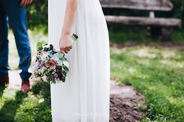 Bride holding flowers.