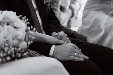 Bride and groom holding hands.