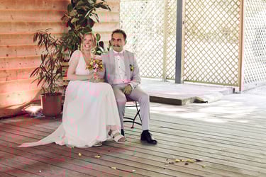 Bride and groom listening to wedding speeches.
