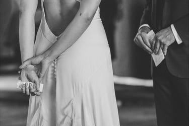 Bride and groom holding their vows.