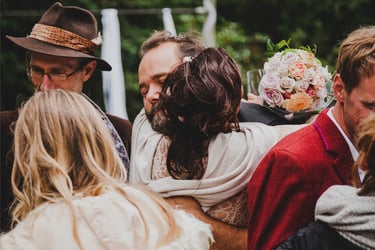 Bride hugging a wedding guest.