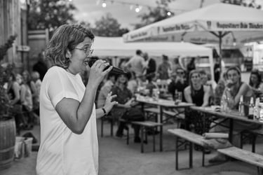 Bride speaking to guests at wedding reception.