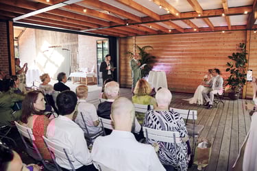 Father of the bride speaking during a ceremony.