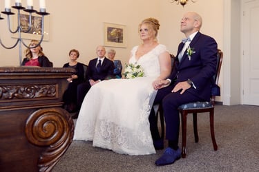 Bride and groom with their family during a civil ceremony.