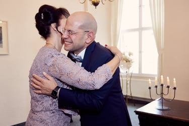 Guest congratulating groom.