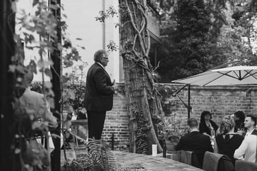 Father of the bride giving a speech at reception.