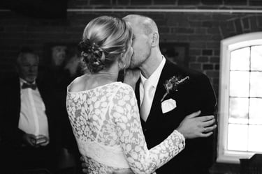 First kiss as a newly wed couple.