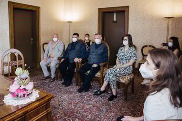 Gay wedding ceremony in a small room.