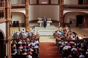 Pastor speaking during a wedding ceremony in Gethsemanekirche.
