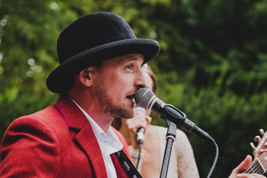 Close-up of groom singing.